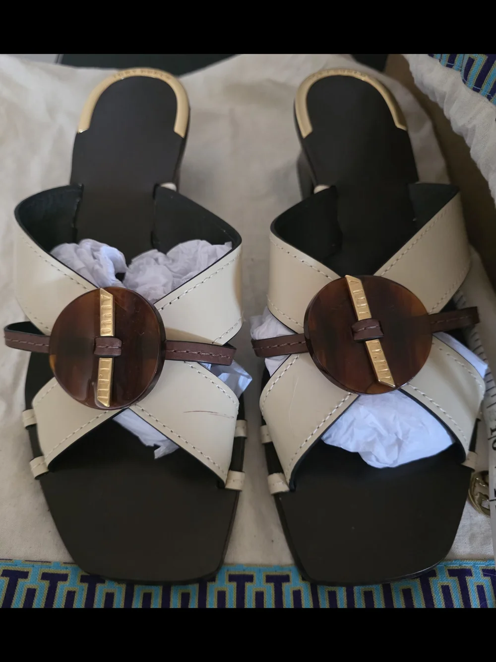 Tory Burch Cream Cross-Strap Slide Mules with Brown Medallion & Gold Accent